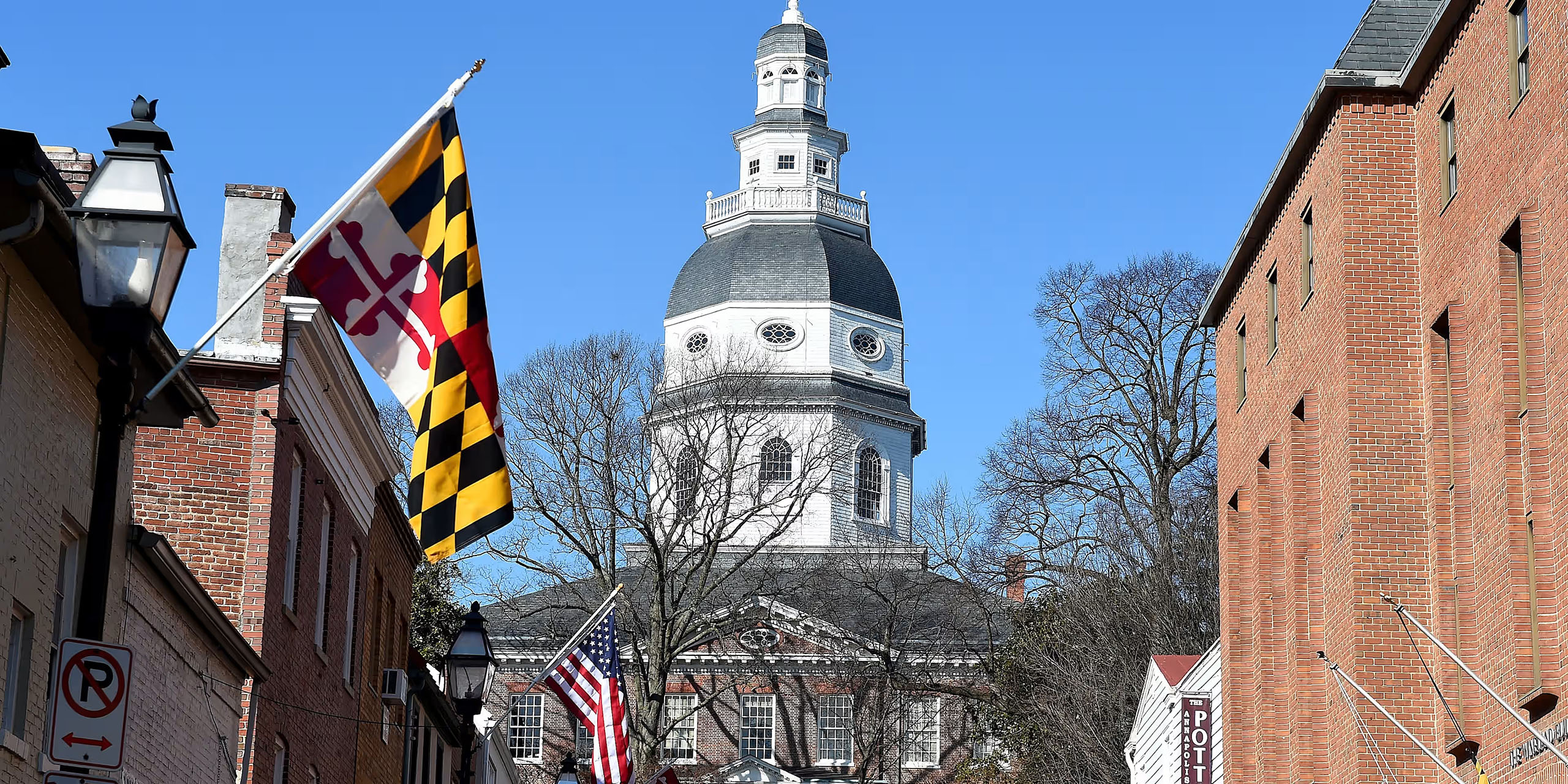 Maryland State House with Maryland flag representing nanny placement services in Maryland